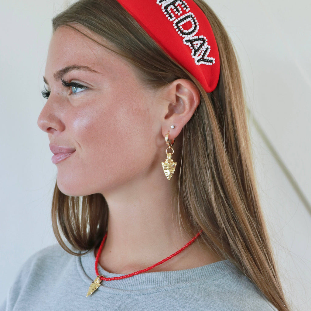 Arrowhead Huggies Earrings in Gold