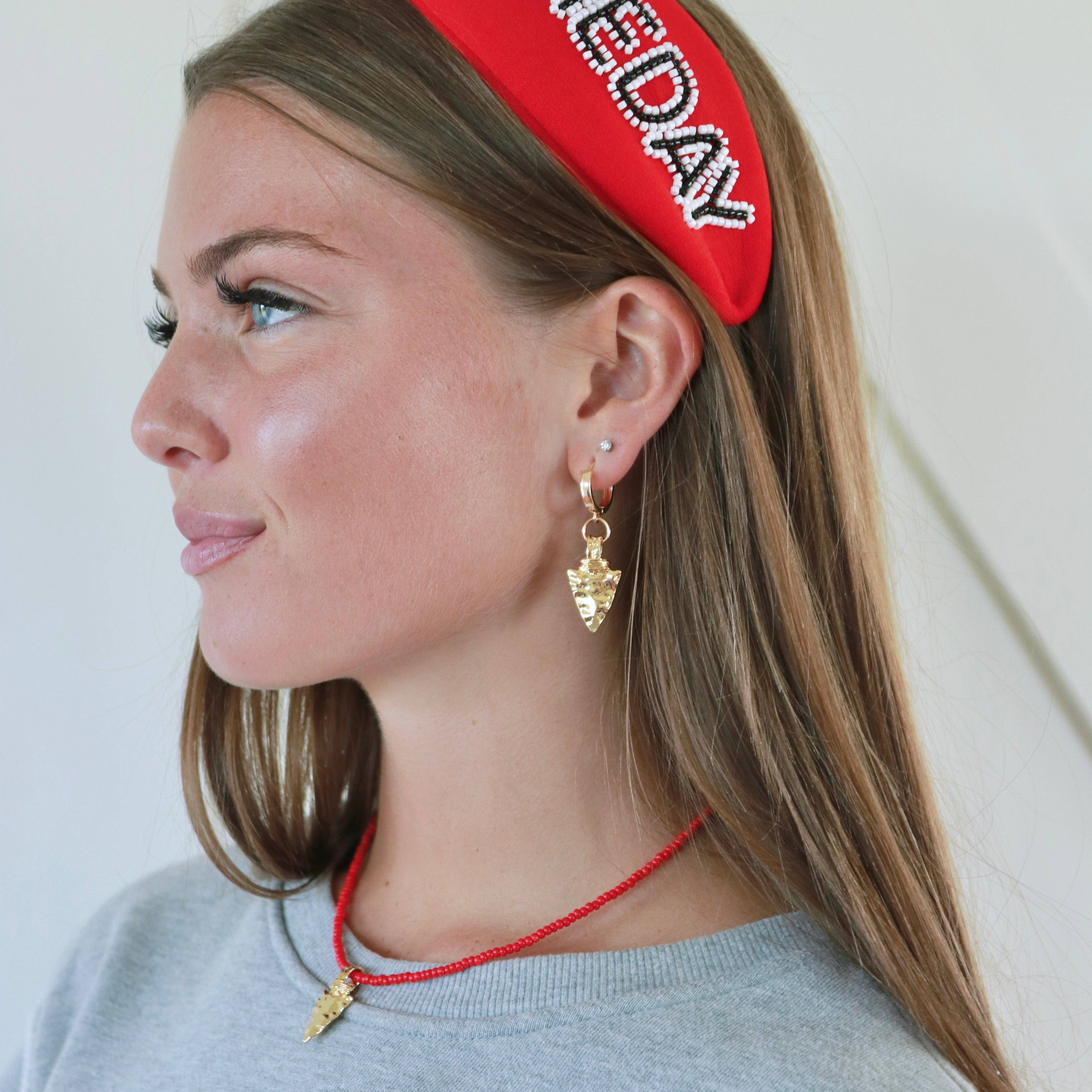 Arrowhead Huggies Earrings in Gold