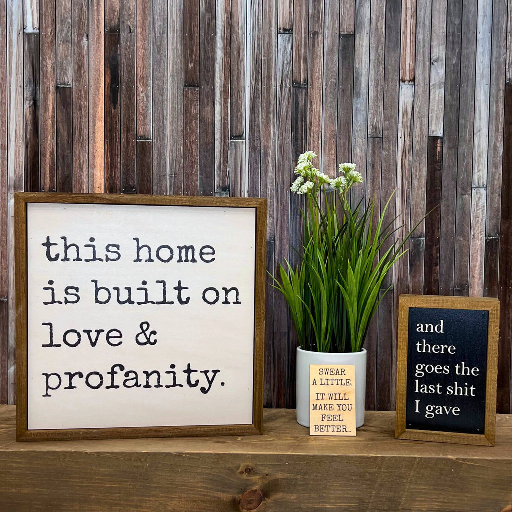 This home is built on love & profanity Wood Sign