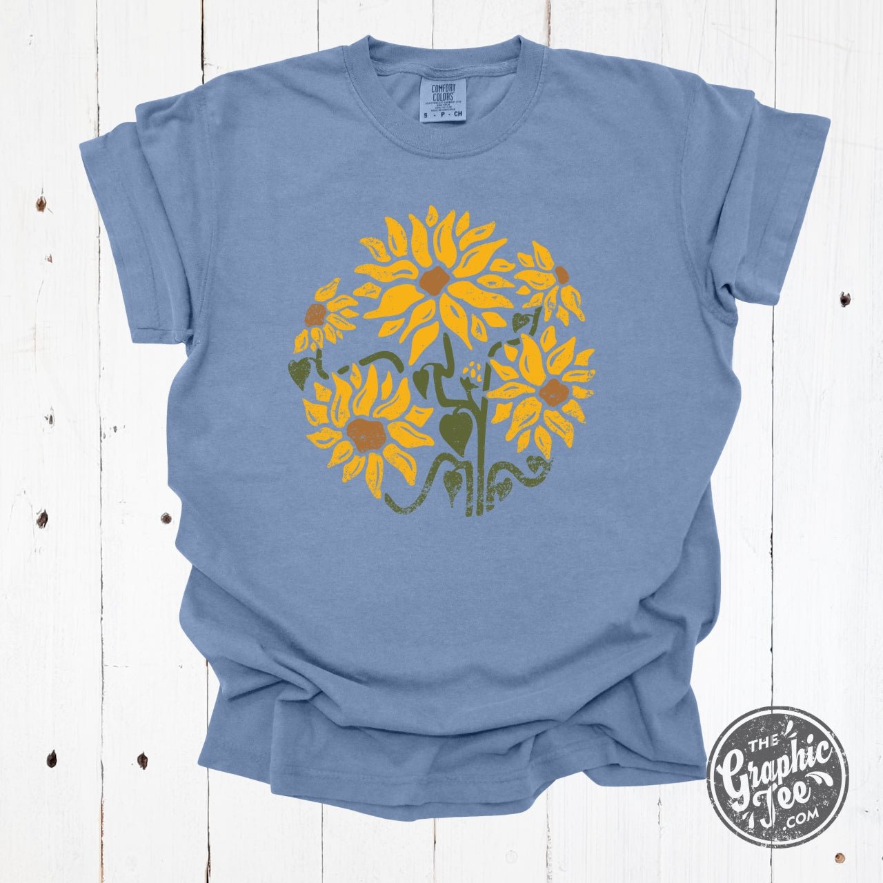She Blooms in Sunshine Washed Denim Comfort Colors Short Sleeve Tee